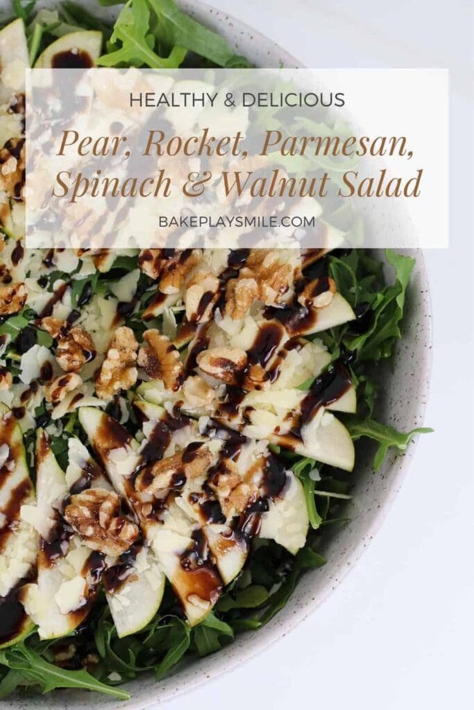 A side salad made of arugula, walnuts, and pears