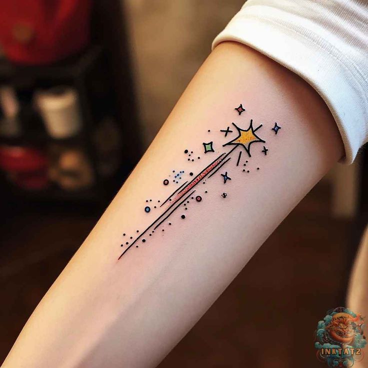 a sparkling shooting star tattoo with comet tail