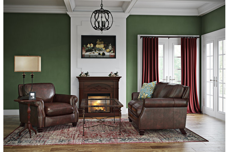 living room with dark academia green and brown color palette with dark wood paneling