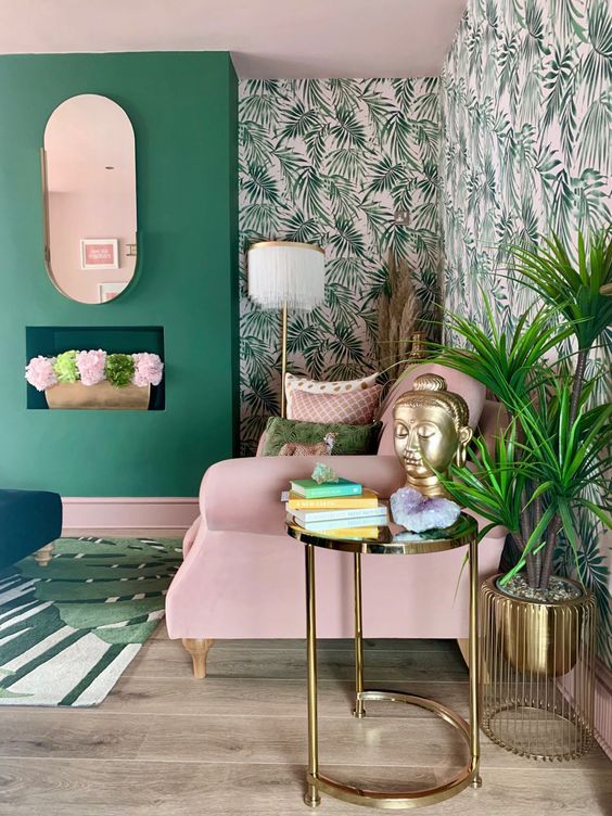 a pink and green living room with plants