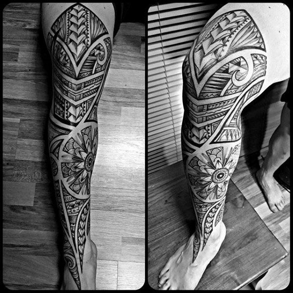 tribal pattern leg sleeve tattoo