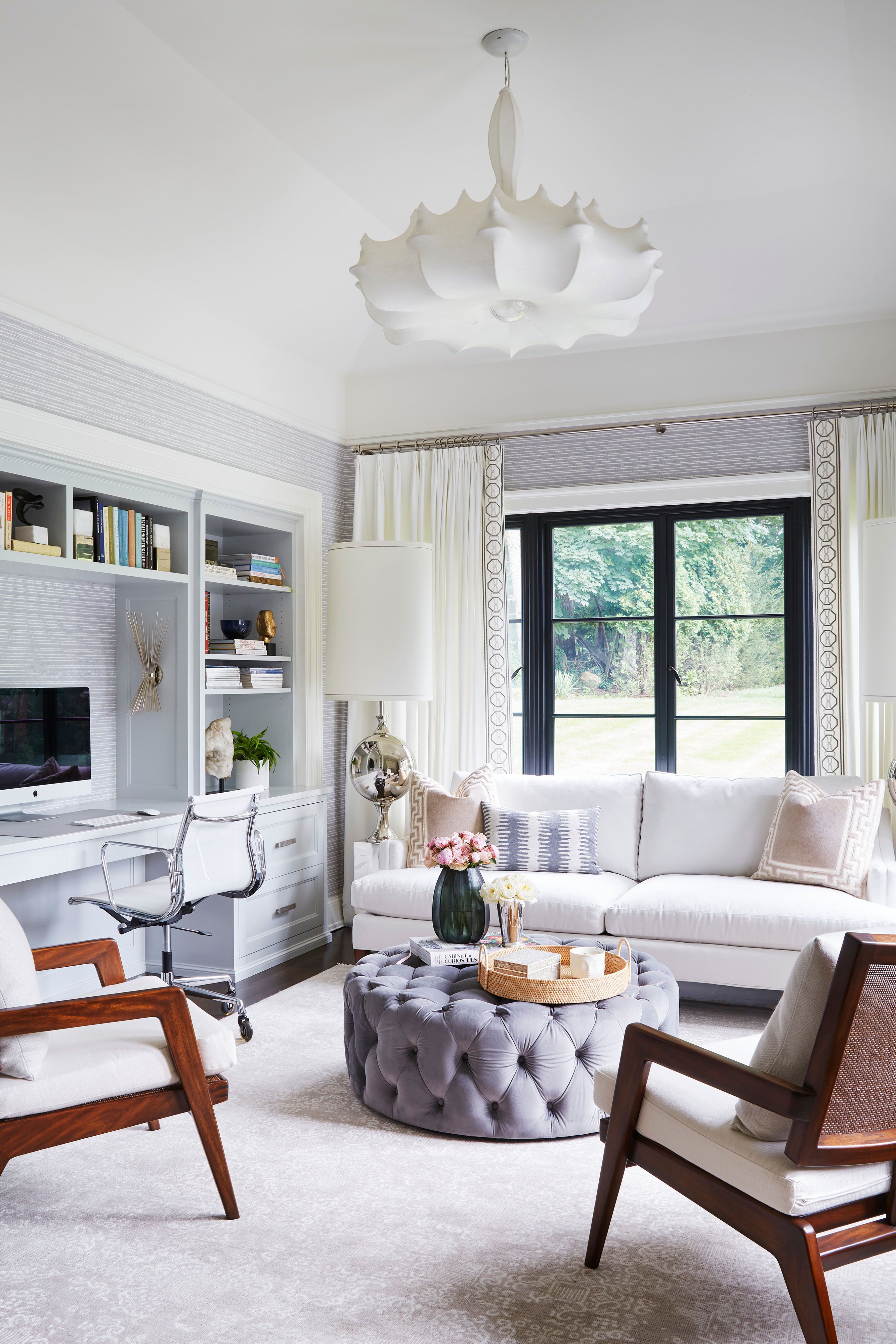 a vintage living room with tufted ottoman
