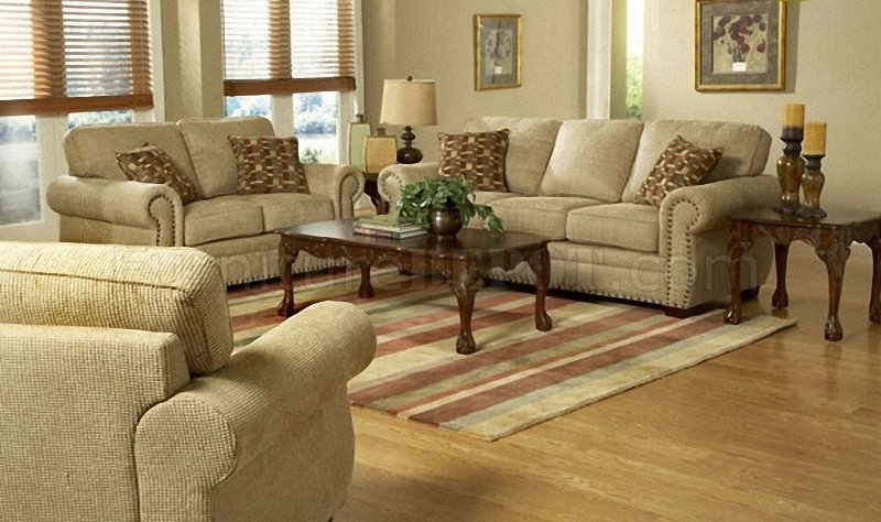living room with traditional cream sofa with rolled arms and nailhead trim