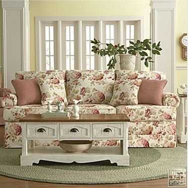 living room with french country cream sofa with floral print