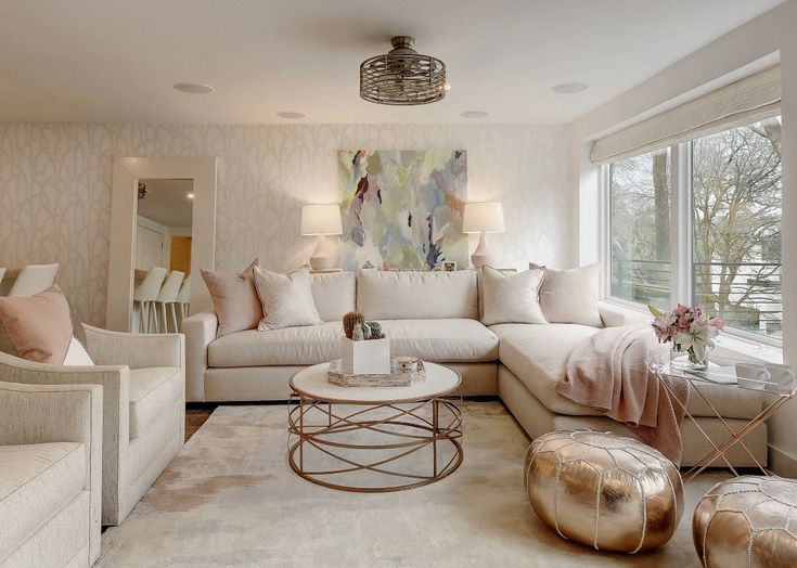 living room with transitional cream sofa with geometric pillows