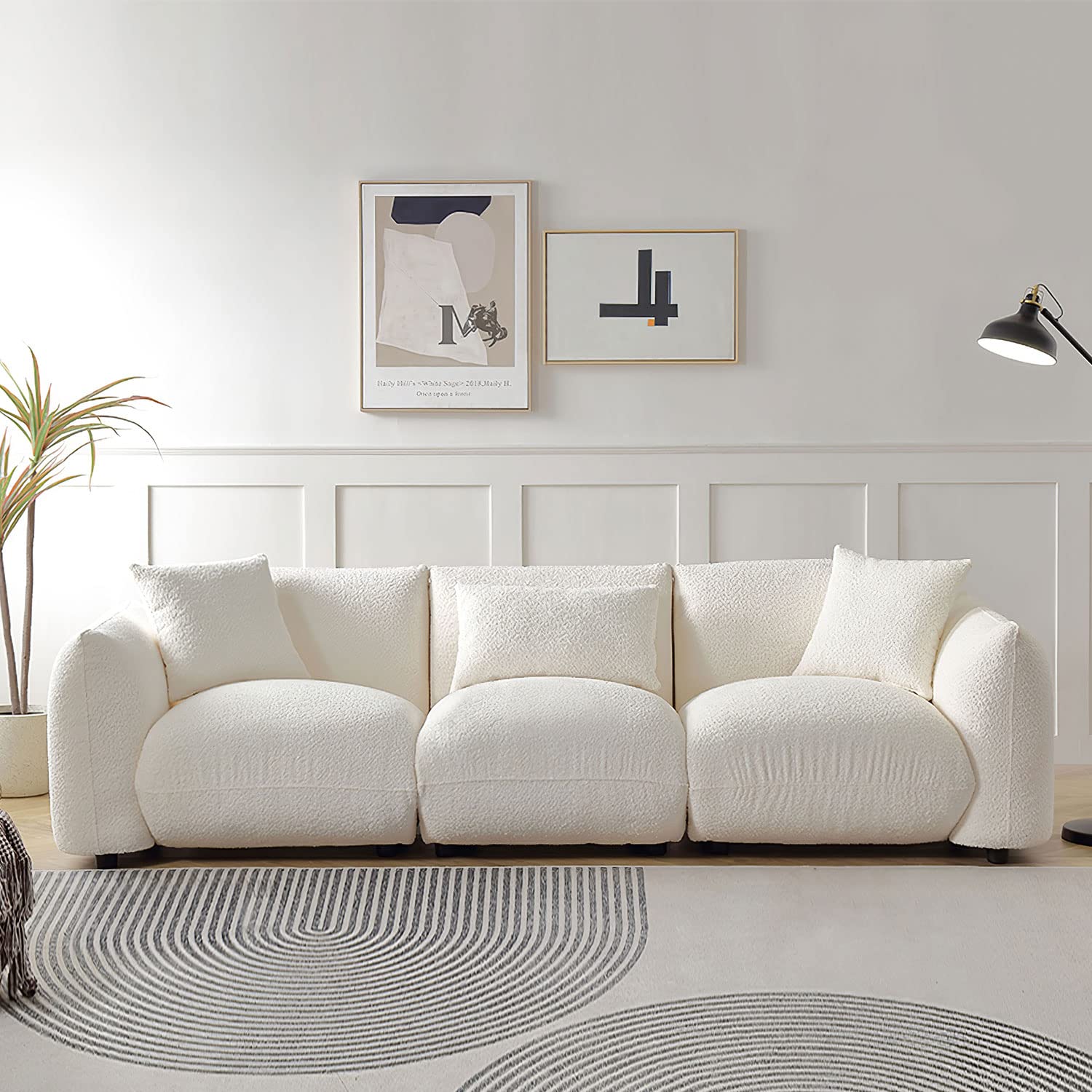 living room with low-profile cream boucl&eacute; sofa for modern aesthetics