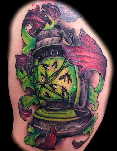 a beautiful firefly tattoo with lantern detail