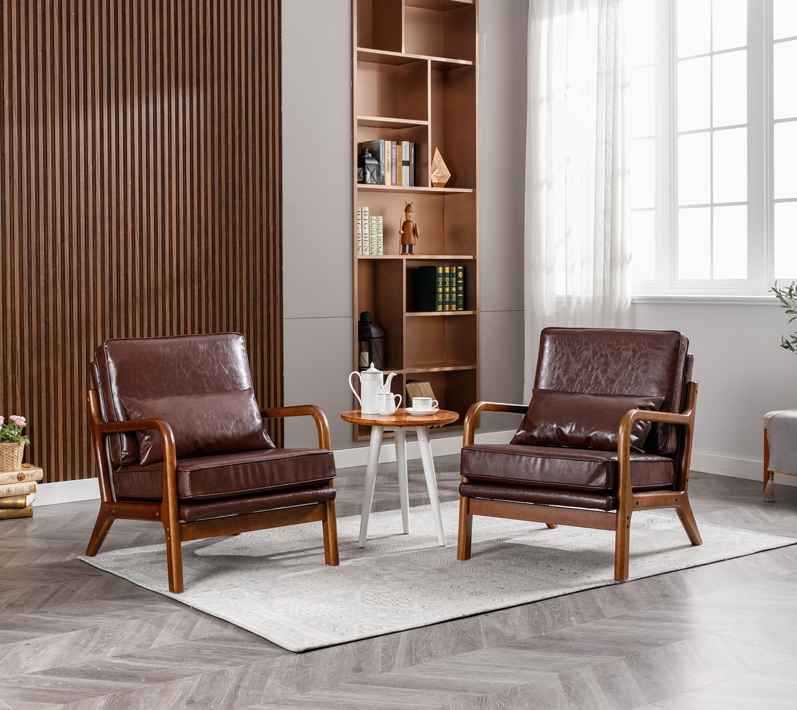 a vintage living room with leather armchairs