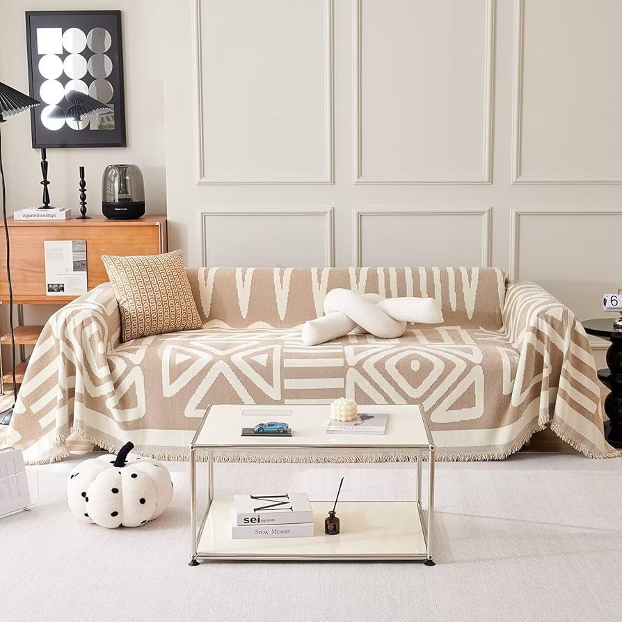 living room with bohemian cream woven sofa with tassels