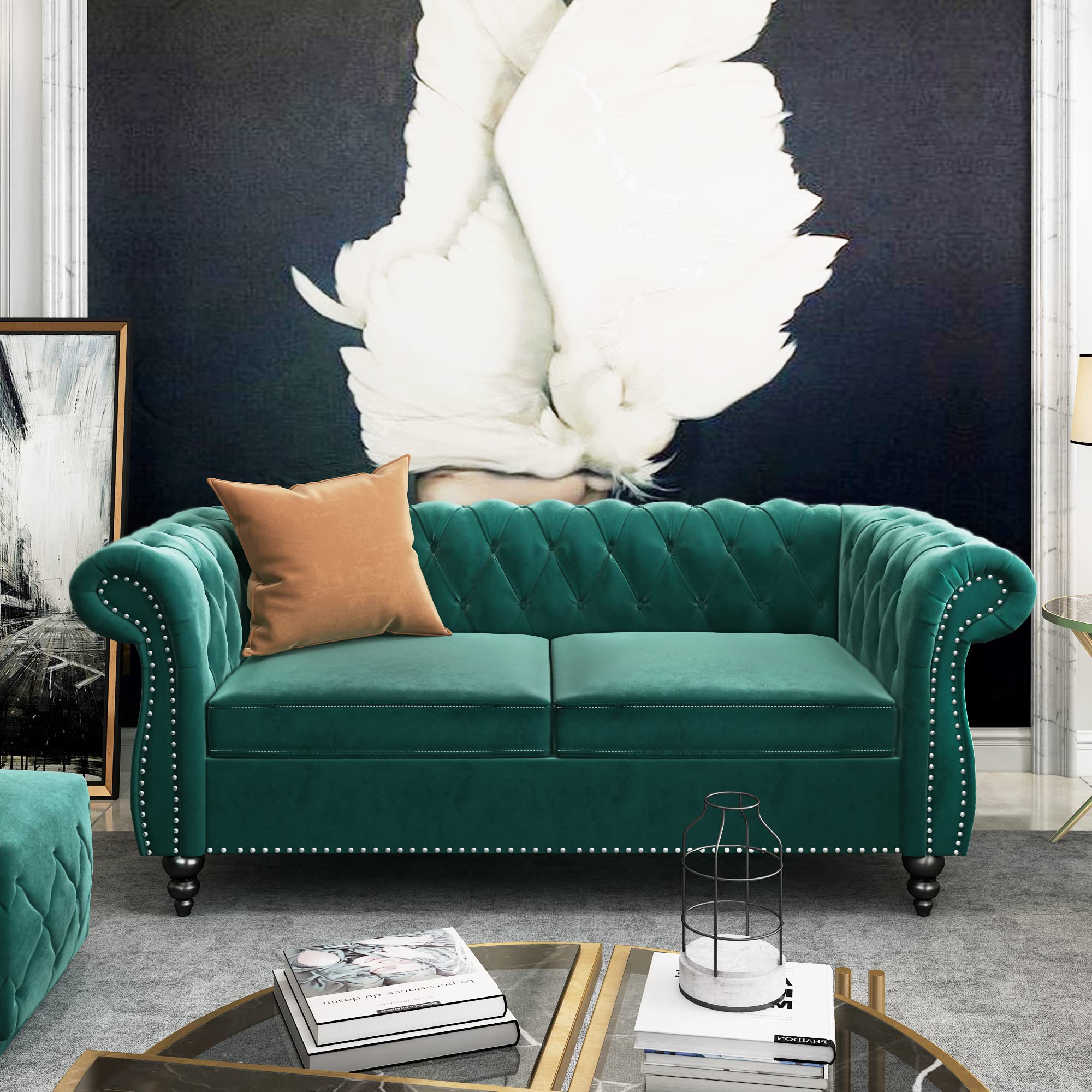 a vintage living room with velvet chesterfield sofa