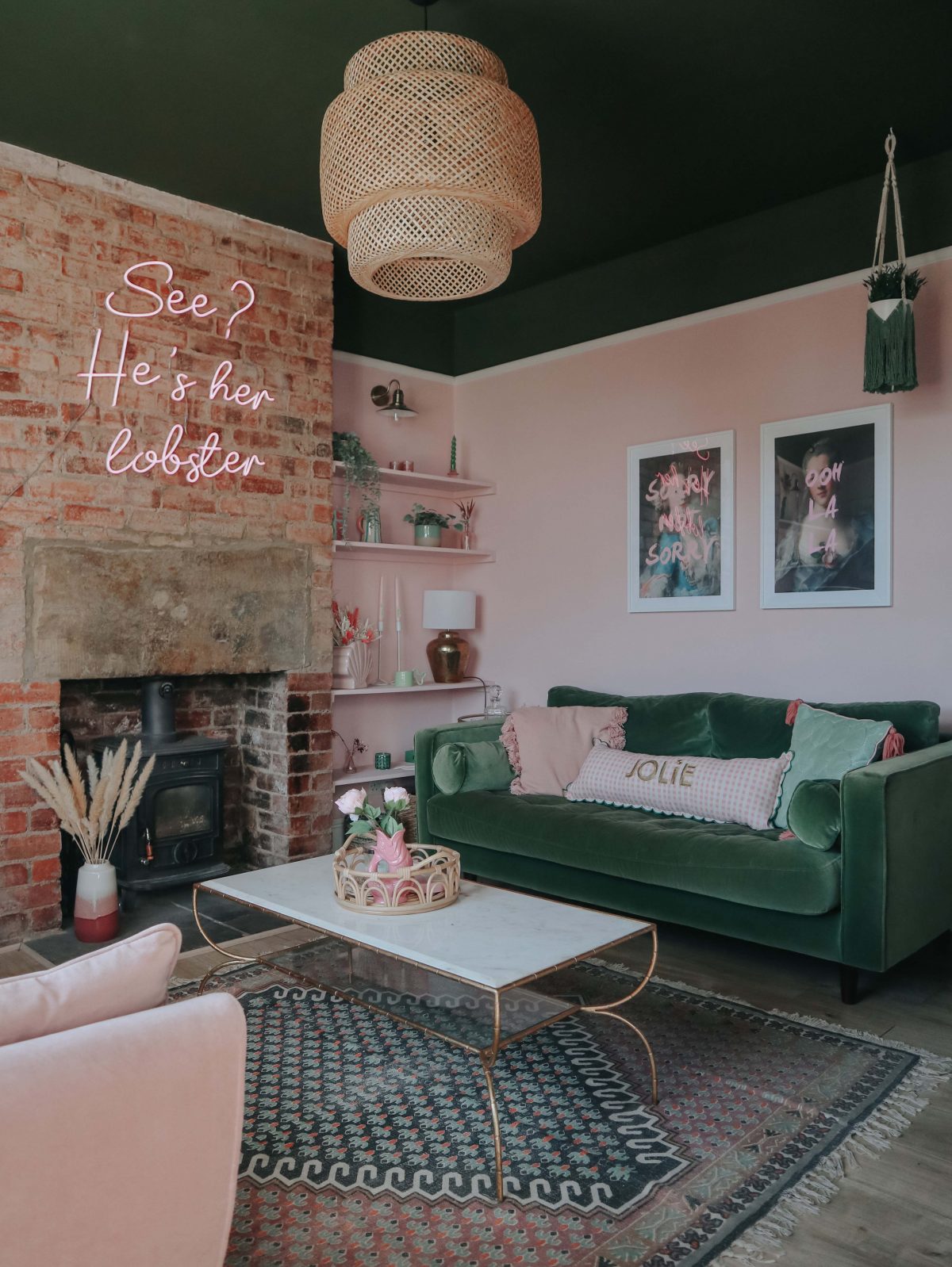 a pink and green living room with lamps