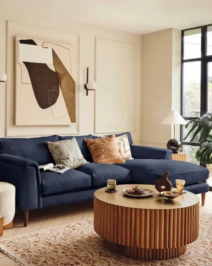 living room with minimalist navy blue couch with clean lines