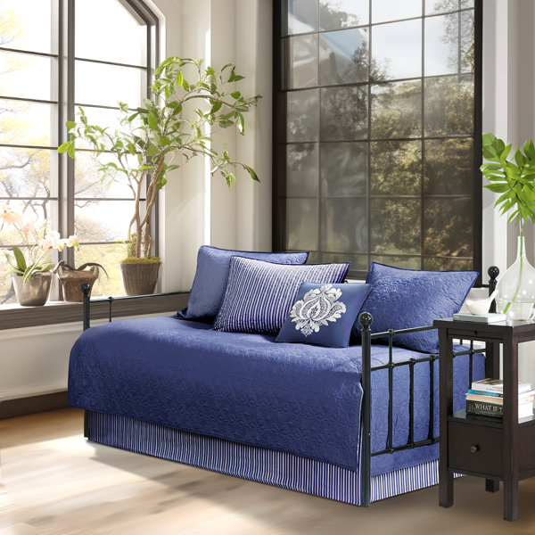 living room with navy blue daybed for relaxation and style