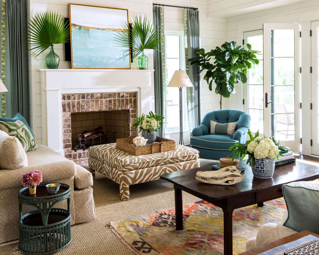 living room with coastal green and brown color palette with driftwood accents