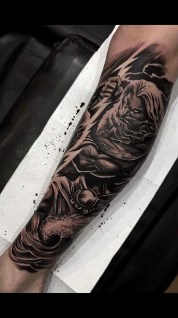 zeus woman's forearm tattoo