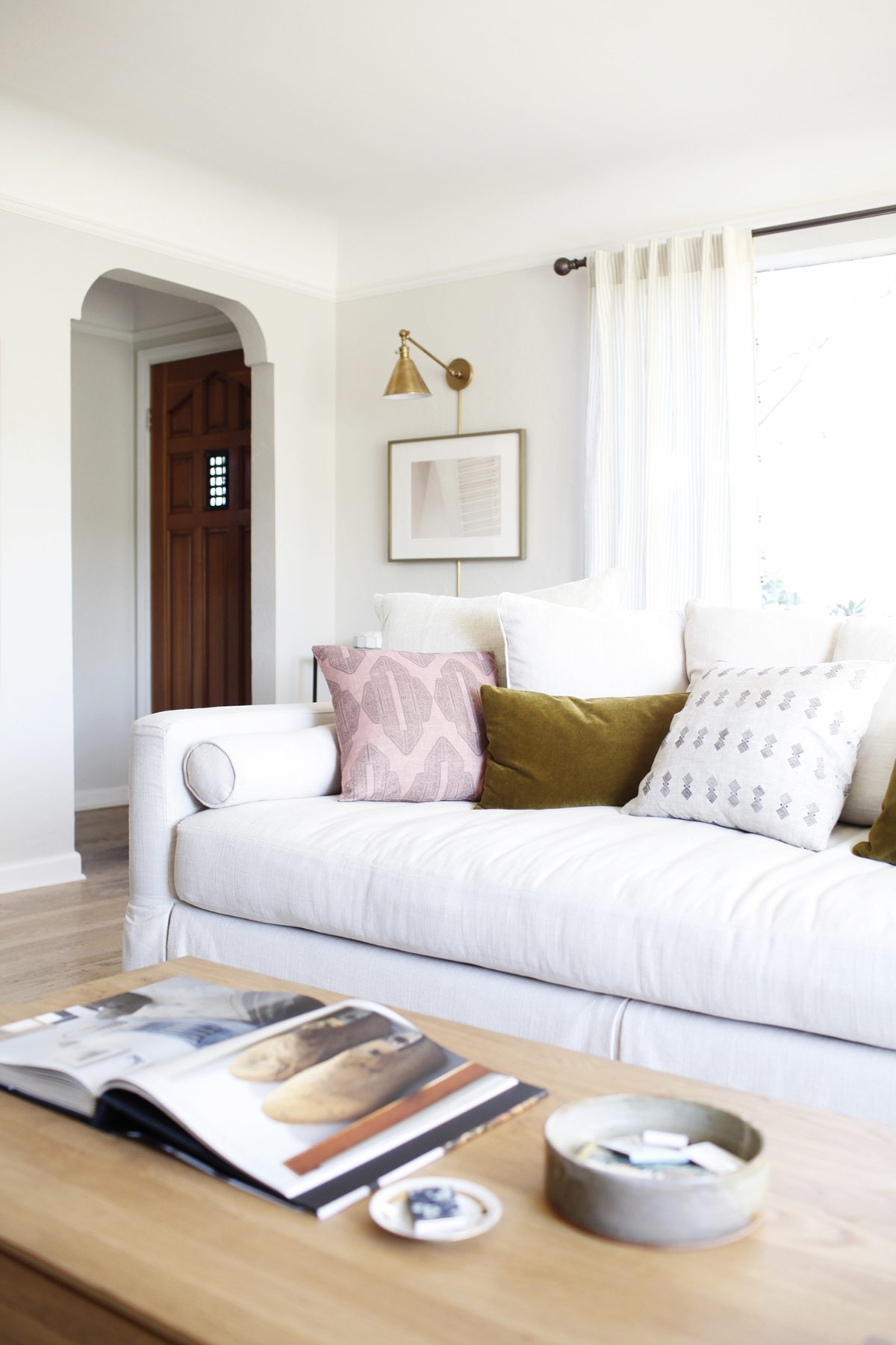 living room with plug-in wall lamps for easy installation