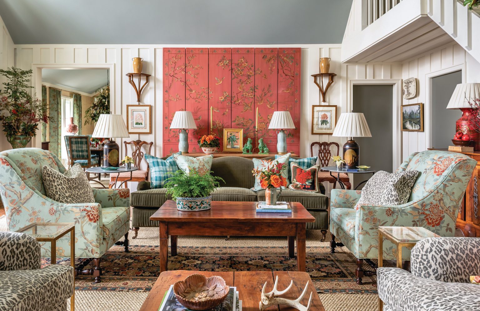 a vintage living room with oriental room divider