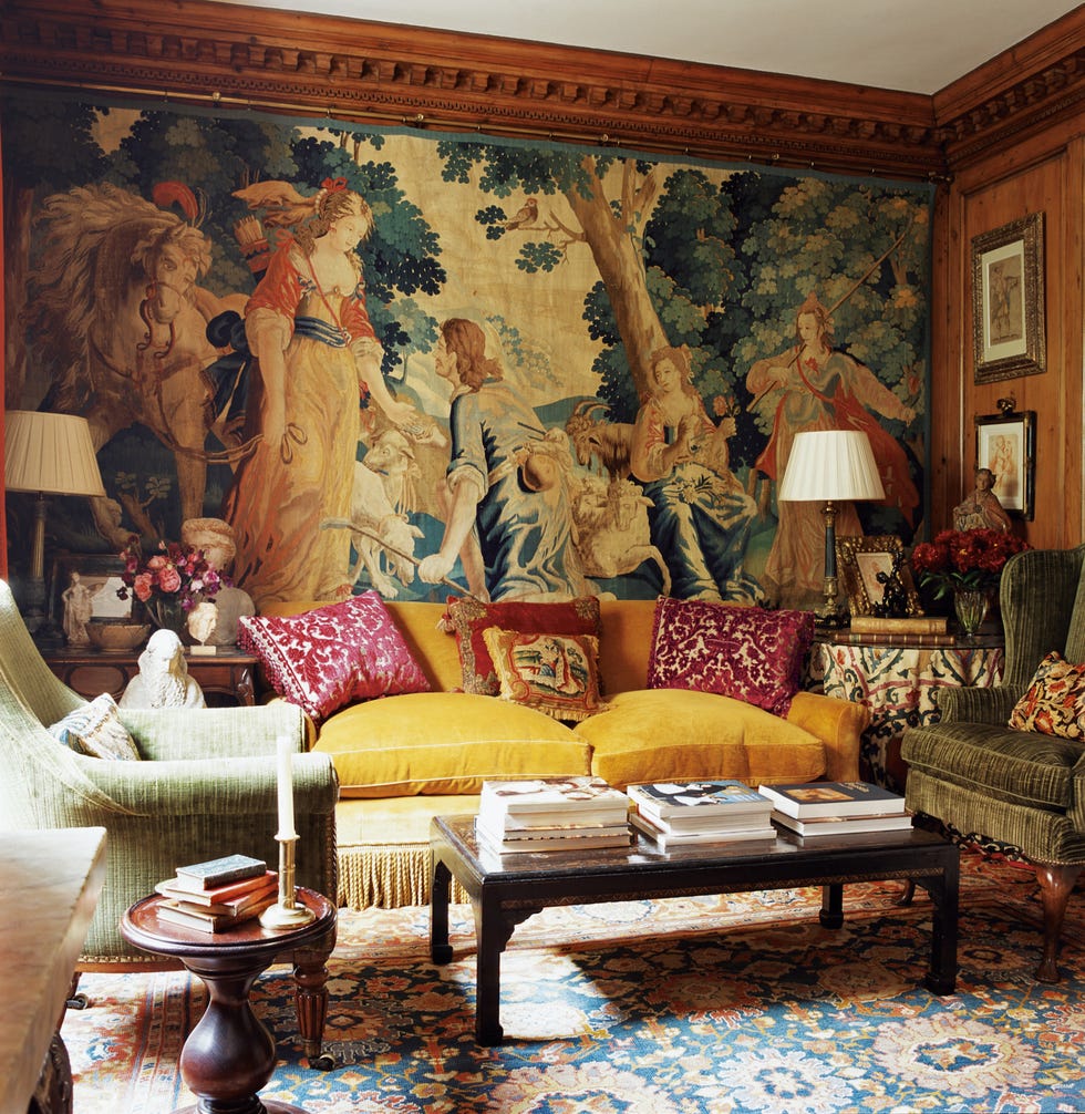 a vintage living room with antique textiles