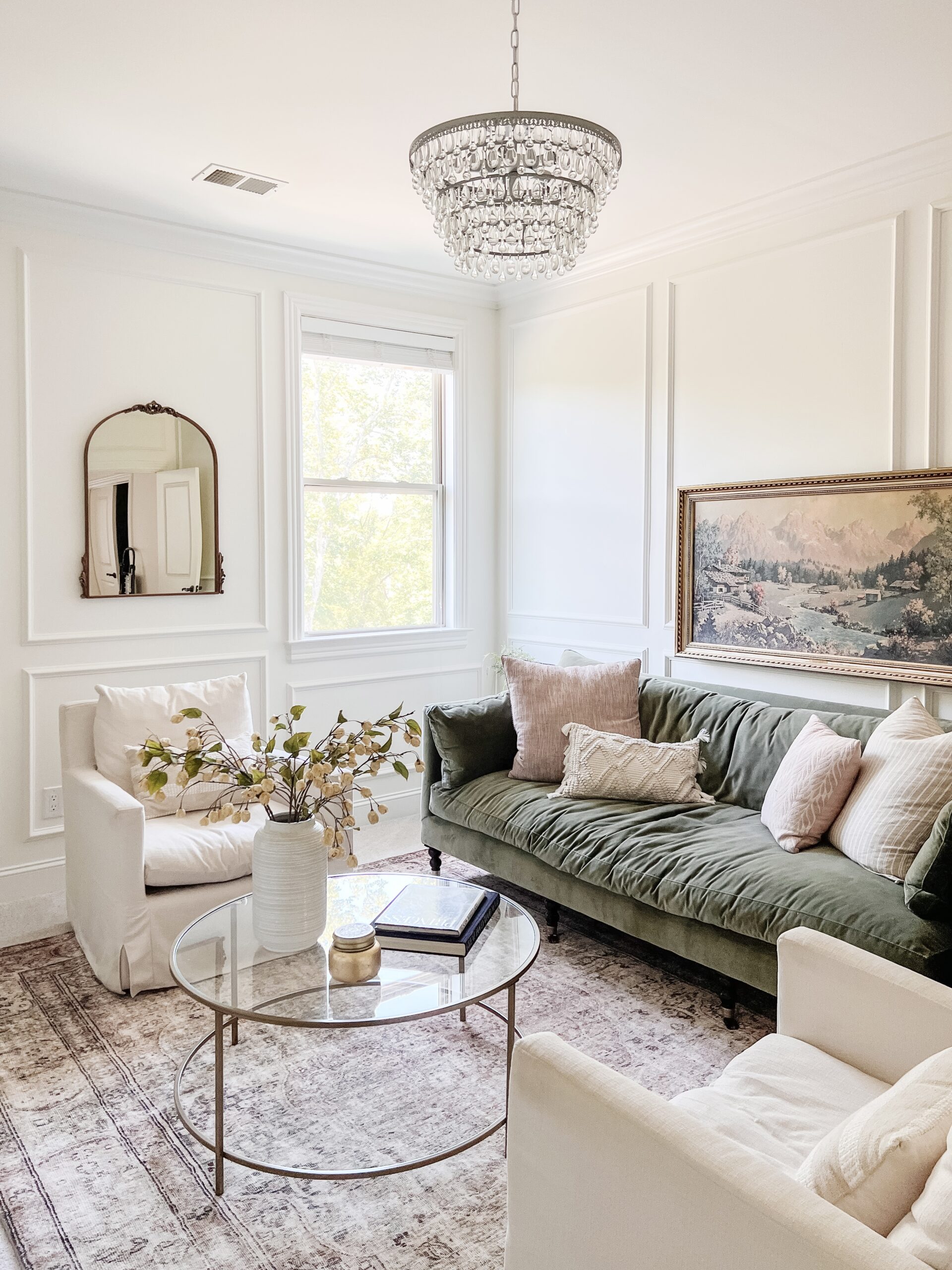 a vintage living room with vintage chandelier