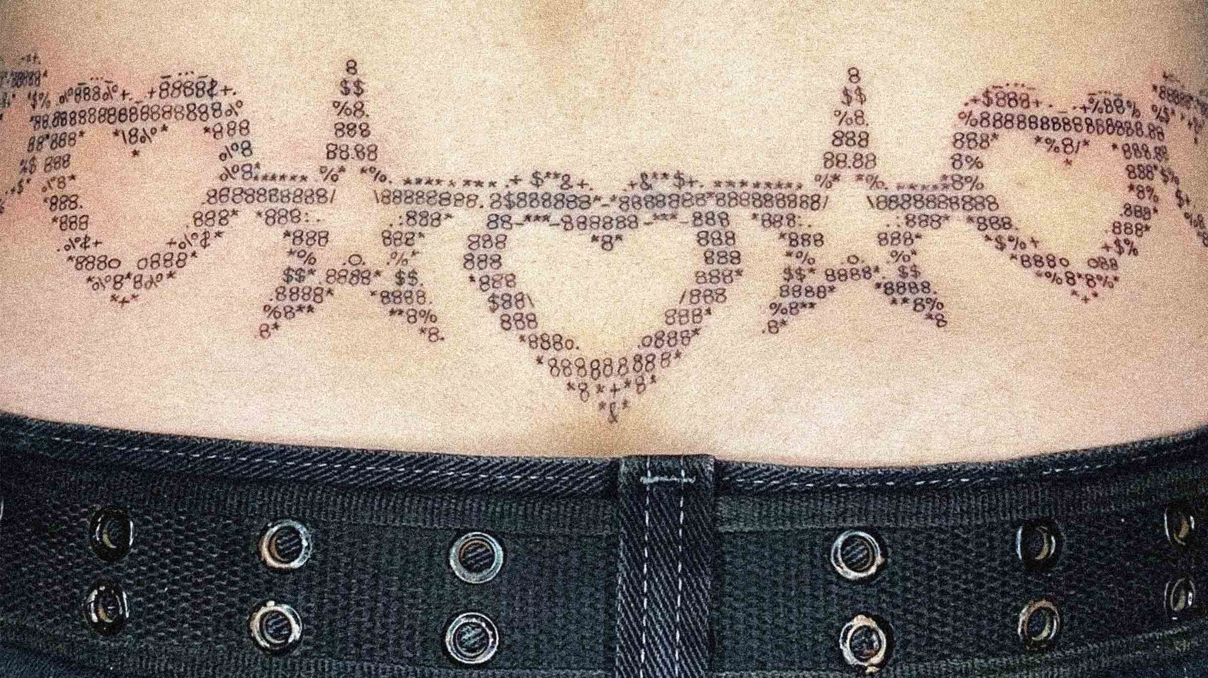 Ancient symbols dance across skin in this mesmerizing ASCII art-inspired tattoo that transforms digital characters into mystical body art ✨ The intricate pattern flows like a digital mandala, with numbers and symbols creating an almost cyberpunk sacred geometry that bridges the gap between technology and spirituality. Positioned along what appears to be a waistline, this piece showcases how modern tattoo artists are reimagining traditional dotwork through the lens of computer culture.