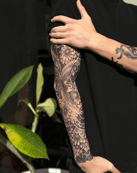 Full sleeve of cranes and clouds that feels weightless