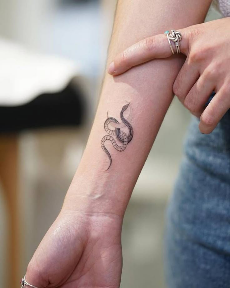 A snake and moon combo that feels witchy but chic