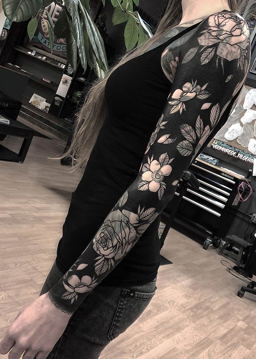 Full blackout sleeve with negative-space flowers